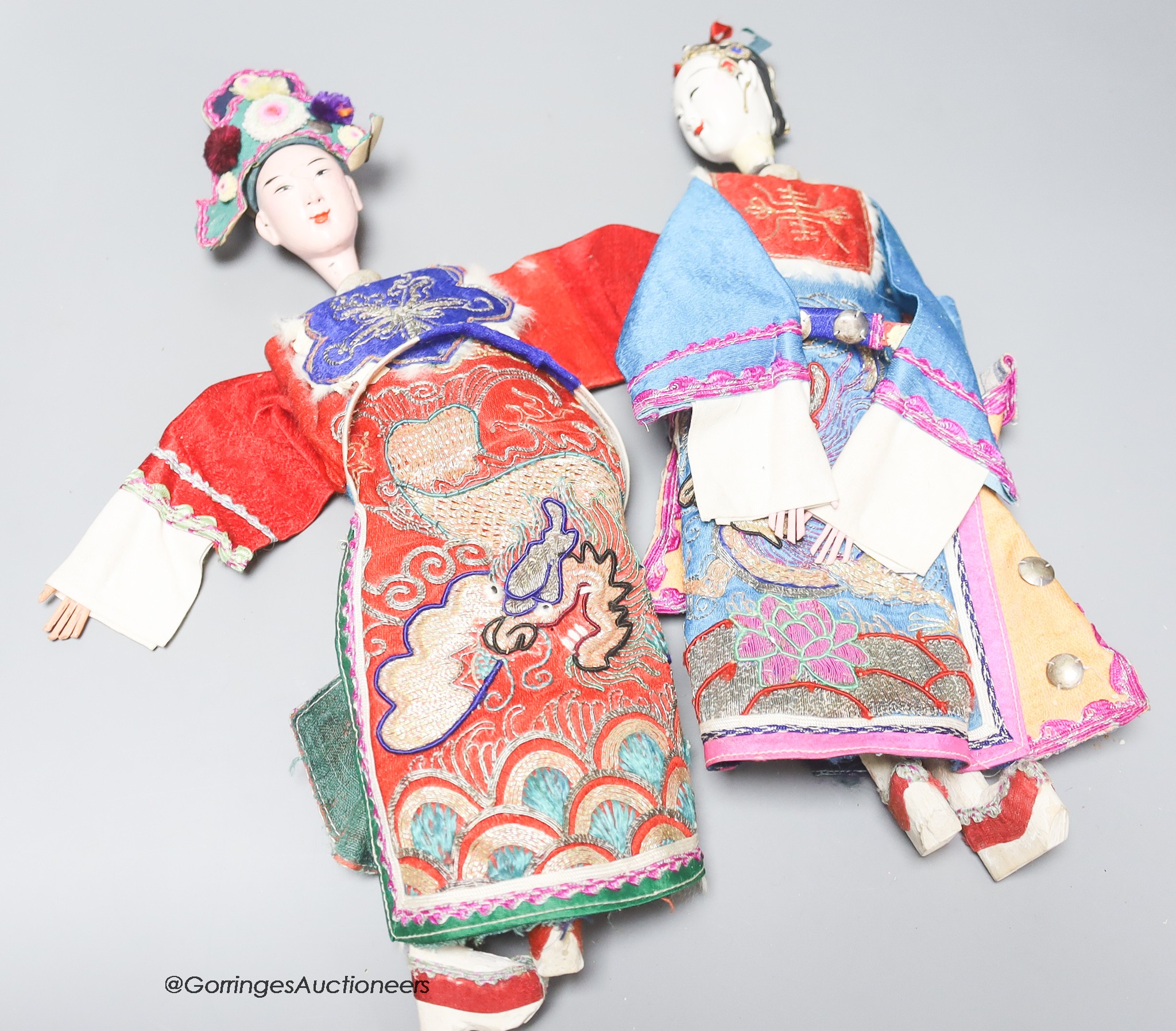 A pair of 20th century Chinese ceremonial dolls